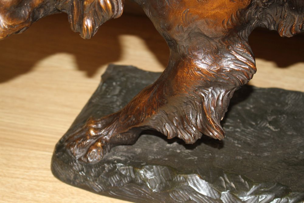 Thomas Francois Cartier (French, 1879-1943). A French bronzed terracotta model of a Gordon Setter, signed, on a naturalistic base,